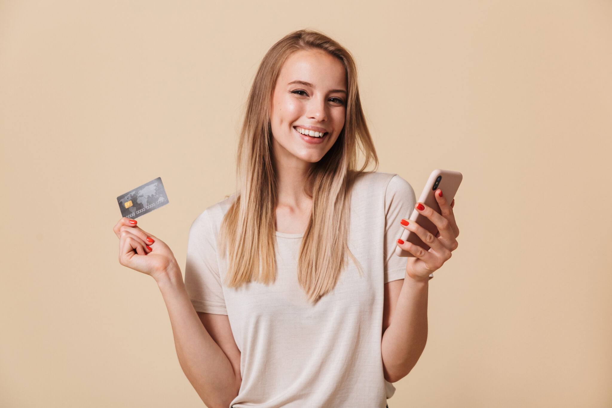 Portrait Of A Woman Holding A Phone And Credit Card