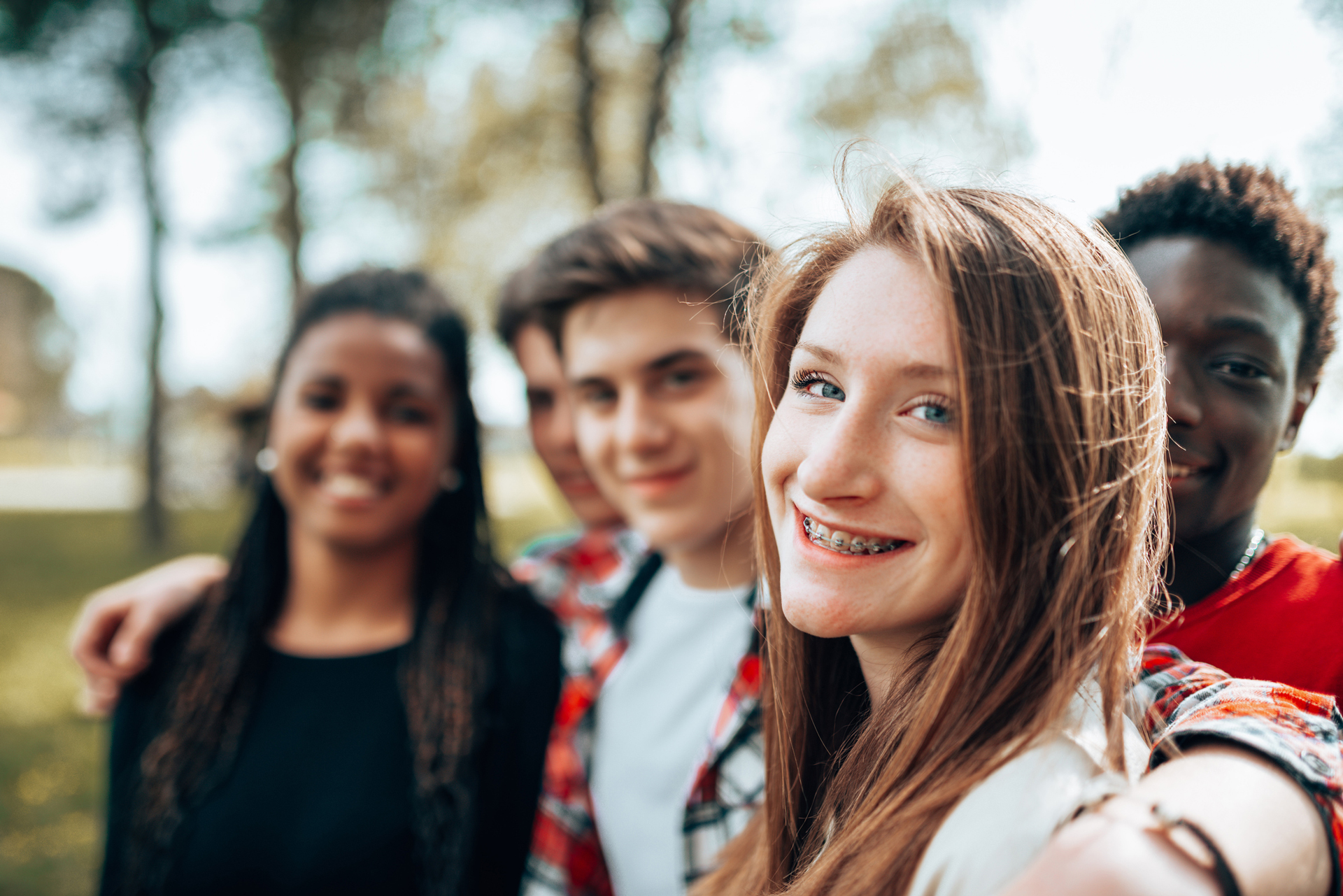 Smiling Group Of Teens Wearing Braces